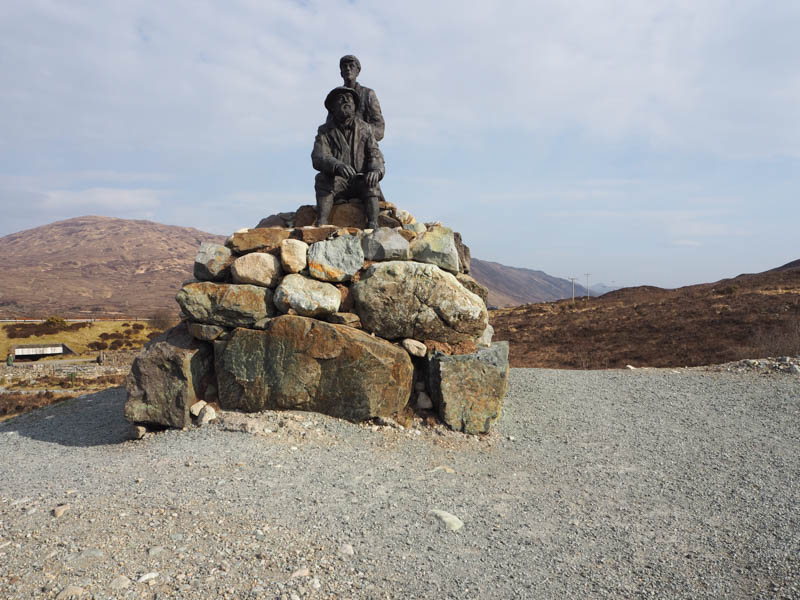 Monument to John Mackenzie (seated) and Norman Collie